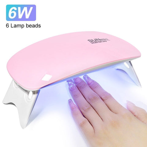 Enjoy fast and efficient nail drying with our 6W power nail dryer. Compact and portable, it features 6 LED UV lights and comes with a USB cable for easy use.